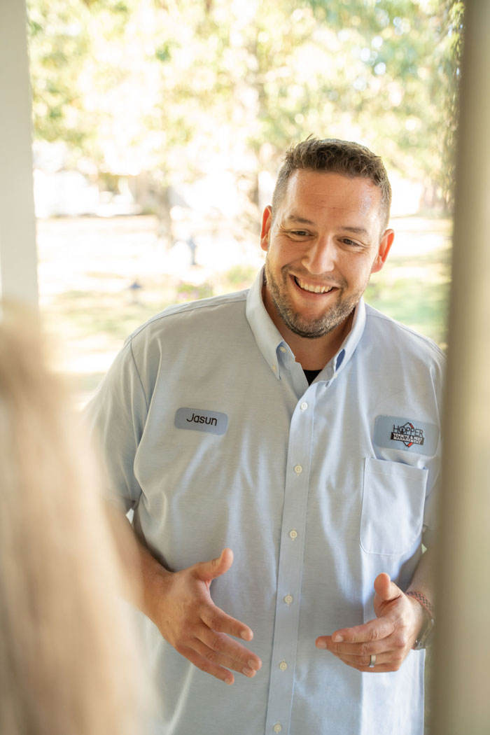 Hopper Pest Control Employee Greeting Customer